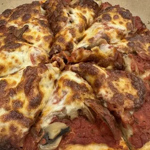 Small pepperoni and mushroom.  A little overcooked and dry.