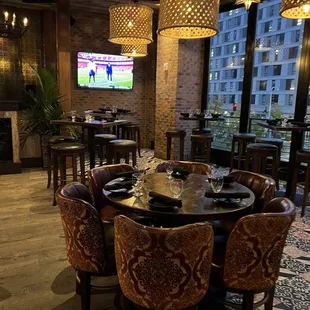 a dining room with a large screen tv