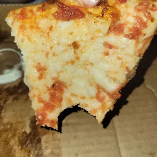 Undercooked crust on hand tossed