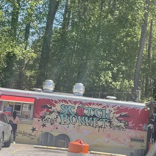 a food truck with graffiti on it