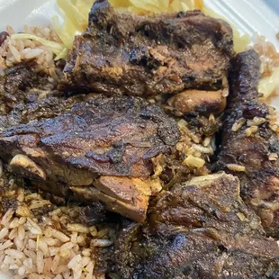 Brown stew chicken, cabbage, with rice n peas