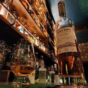 a bottle of scotch on a bar counter