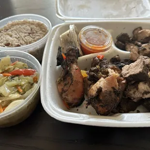 Ya Man Combo - Jerk pork, jerk chicken (dark), rice and peas, and cabbage/veggie mix.