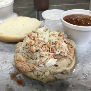 ows a sandwich with coleslaw and coleslaw