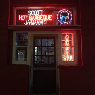 a neon sign for a hot bar