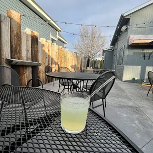 a glass of lemonade on a table