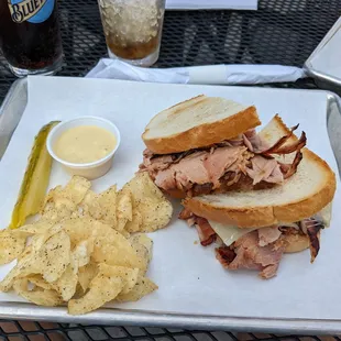 Ham and cheese with potato chips.
