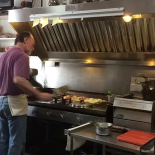 a man preparing food in the kitchen