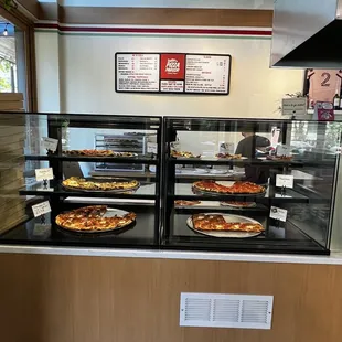 Storefront POV... Pizza display.