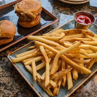 a plate of french fries and a burger