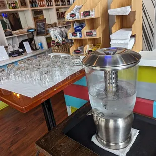 Self serve water and condiments station