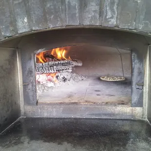 Inside the Wood Burning Oven... that is My Pizza on the right!!  YUMMY.