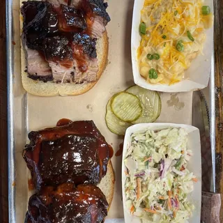 Choose 2 Combo Brisket or Burnt Ends, Pulled Pork, Chicken Thighs, Turkey, Housemade Chipotle Ghost Peperjack Sausage, Wings