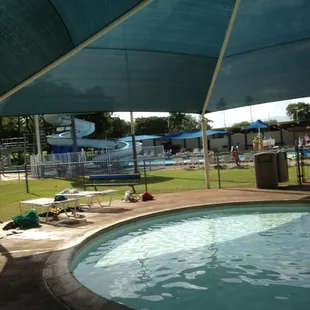 Wading pool with slide in the background