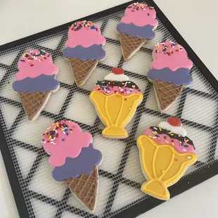 ice cream cones decorated with sprinkles and sprinkles