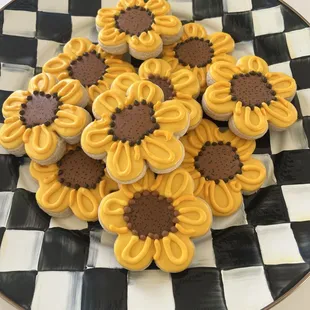a plate of sunflower cookies