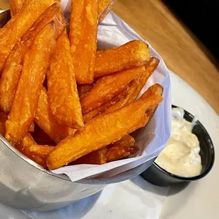 a basket of sweet potato fries