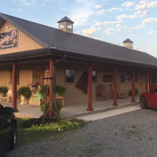 a red car parked in front of a building