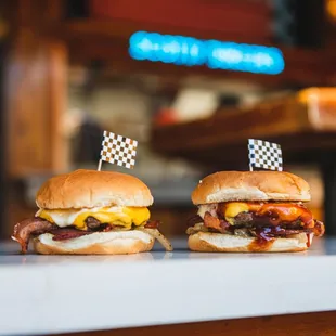 two burgers on a counter