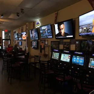 a row of televisions in a sports bar