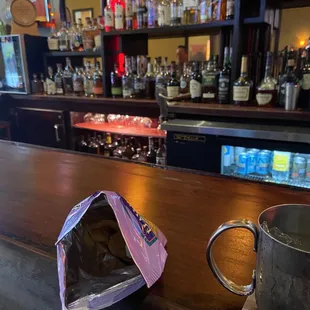 a cup of coffee on the bar