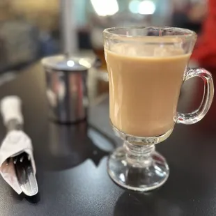 a cup of coffee on a table
