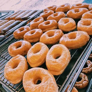 a bunch of doughnuts on a cooling rack