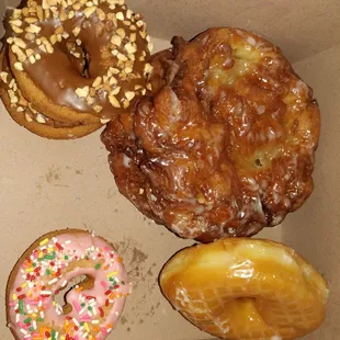 Apple fritters, chocolate with nuts, glazed, and strawberry with sprinkles. Best donuts around in my opinion.