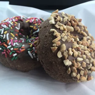 Chocolate cake donut with sprinkles or peanuts