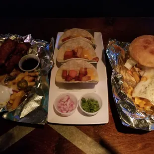 The spread. Chicken tenders. Pork belly tacos. Chicken sandwich. Fries special request. One dirty one with over easy egg