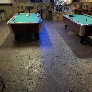 two pool tables in a pub