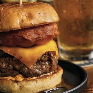 a burger with bacon and cheese