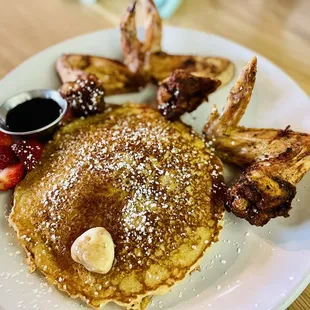 a plate of pancakes and french fries