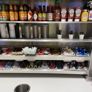 a shelf full of condiments