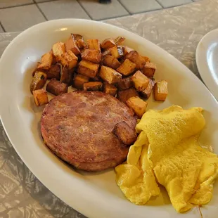 Housemade sausage infused with cheese and bacon, potatoes and fluffy eggs