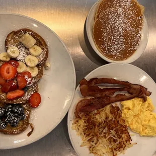 two plates of breakfast food