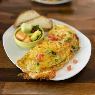 an omelet with a side of fruit