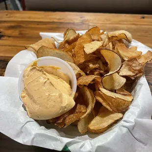 Homemade potato chips and dipping sauce.