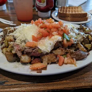 Camper&apos;s Special Skillet - tender sirloin, green chilies, bell peppers, onions, &amp; country potatoes fried together.