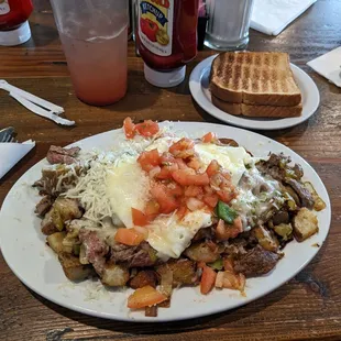 Camper&apos;s Special Skillet - tender sirloin, green chilies, bell peppers, onions, &amp; country potatoes fried together.
