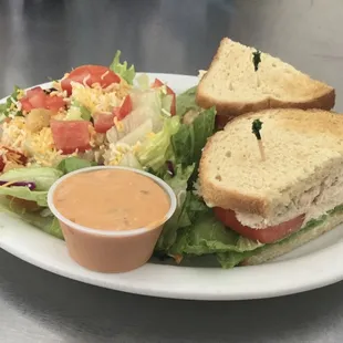 a sandwich and salad on a plate
