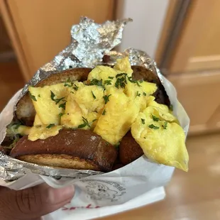  hand holding a sandwich