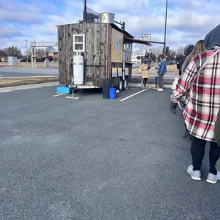  woman standing in front of a food truck