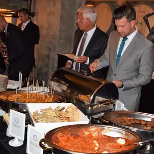 roasted red pepper meatballs, lemon chicken bow ties with artichokes and capers, warm tomato goat cheese with toast, crab cakes, grilled veg
