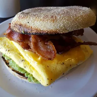 Bacon, egg, American cheese on homemade English muffin, with the added avocado.