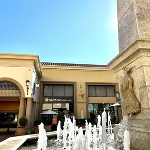 By fountain in Fashion Island