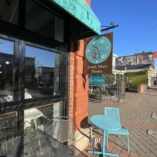 a blue table and chair outside