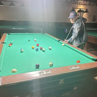 a man playing pool