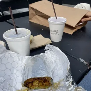 Half a scratch burrito with a cold brew and the raspberry yerba mate