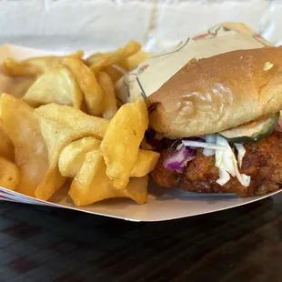 Nashville chicken sandwich with fries.